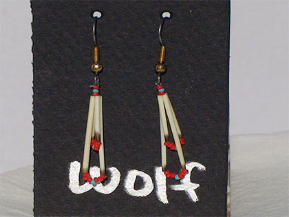 Two short quills and the two long quills all connected with Turquoise and red size thirteen cut glass beads. Ear attachment is French Hooks